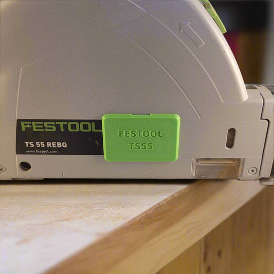 Festool TS55 Plunge Saw with a colour-matched green plastic cover cap over the arbour hole